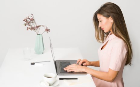 woman in pink dress using laptop computer 1586973 1 scaled