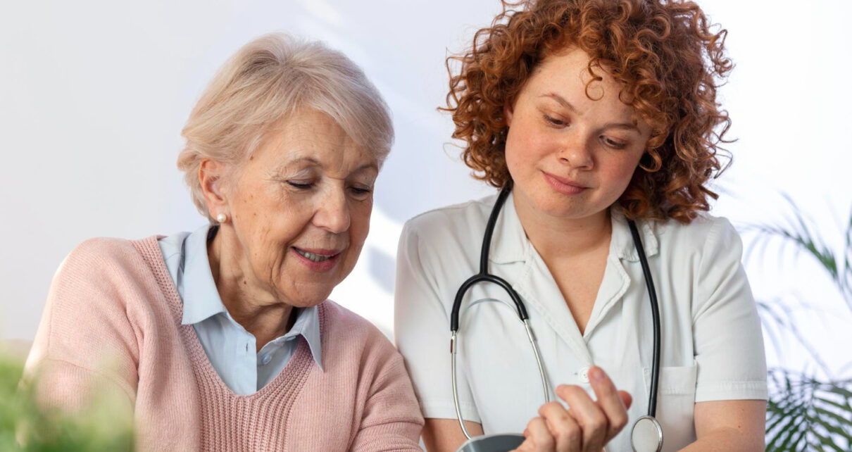 caregiver measuring blood pressure senior woman home kind carer measuring blood pressure happy elderly woman bed nursing home